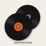 Two 12 inch control vinyl records wearing custom round labels
