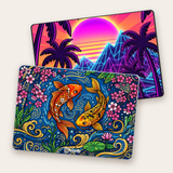 Two MacBooks wearing custom skins, a koi pond design and a synthwave sunset, each with the small Stickers Made EZ logo