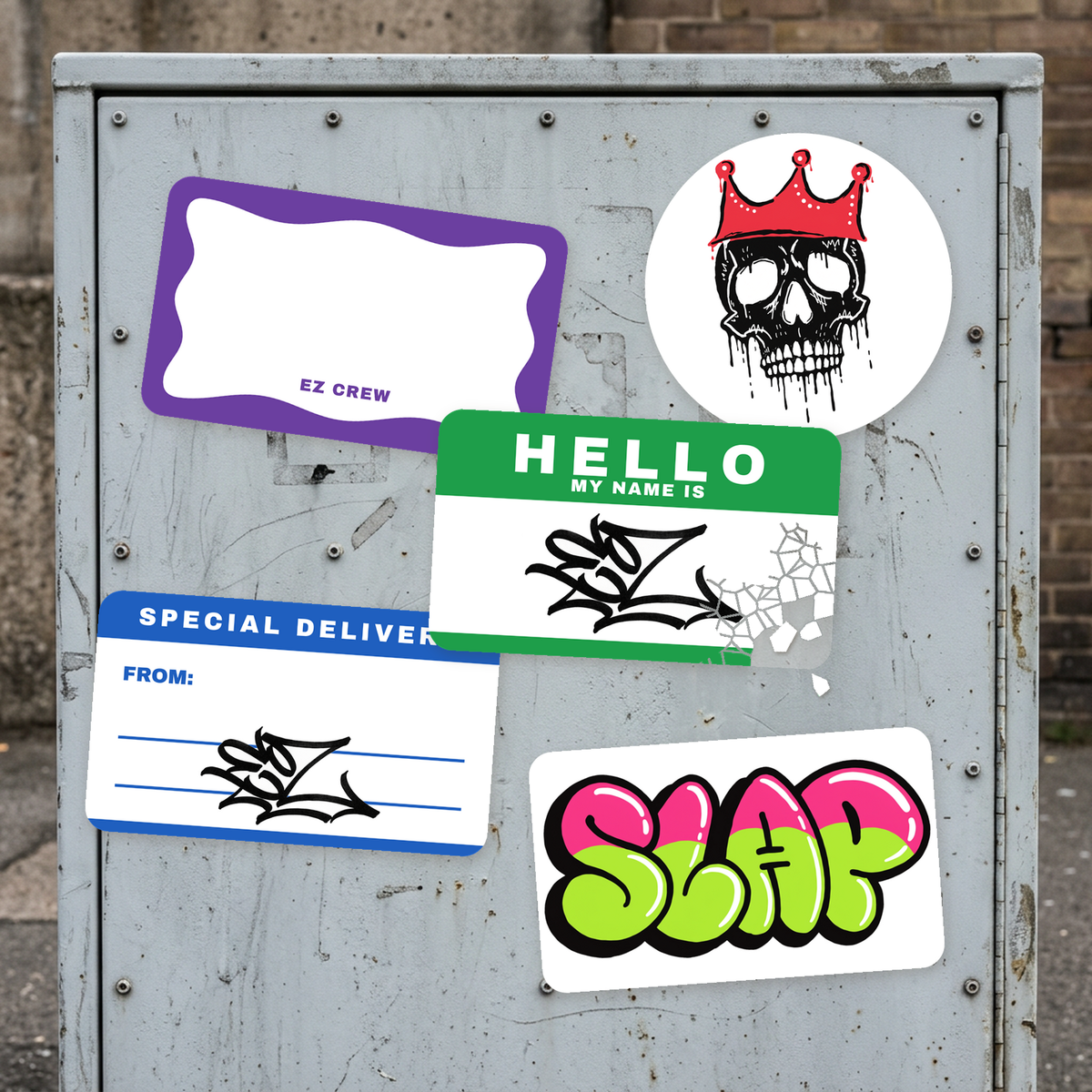 Custom eggshell stickers slapped on a grey utility box: a tagged Hello label cracking where someone tried to peel it, a wavy border blank, a mail label, a throw-up and a crowned skull